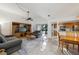 Open concept living and dining area with kitchen access at 600 Cranes Way # 206, Altamonte Springs, FL 32701