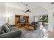 Living room with access to balcony and kitchen at 600 Cranes Way # 206, Altamonte Springs, FL 32701