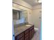 Bathroom featuring vanity with granite countertop and a walk-in bathtub with safety bars at 607 Waverly Ln # 403, Maitland, FL 32751