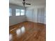 Bedroom featuring hardwood floors, ceiling fan, and a pair of closets with louvered doors at 607 Waverly Ln # 403, Maitland, FL 32751