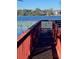 View of the community dock with wooden rails and lake at 607 Waverly Ln # 403, Maitland, FL 32751