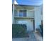 Two-story condo features a balcony, well maintained yard, and neutral color scheme at 607 Waverly Ln # 403, Maitland, FL 32751