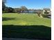 Exterior lawn of the condominium with a partial view of the pool at 607 Waverly Ln # 403, Maitland, FL 32751