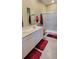 Double vanity bathroom with a walk-in shower at 648 Daring Dr, Davenport, FL 33837