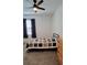 Cozy bedroom with a twin-sized bed and ceiling fan at 648 Daring Dr, Davenport, FL 33837