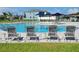 Relaxing community pool with ample lounge chairs at 648 Daring Dr, Davenport, FL 33837