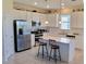 Spacious kitchen featuring stainless steel appliances and an island at 648 Daring Dr, Davenport, FL 33837