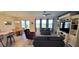 Spacious living room with a large TV and comfortable seating at 648 Daring Dr, Davenport, FL 33837