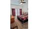 Main bedroom with a king-sized bed and ceiling fan at 648 Daring Dr, Davenport, FL 33837