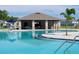 Community pool with a covered patio at 648 Daring Dr, Davenport, FL 33837