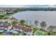 Gorgeous waterfront condo with pool and dock access, set against a backdrop of a serene lake and city skyline at 660 Killarney Bay Ct # 6, Winter Park, FL 32789