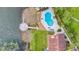 Aerial view of the waterfront condo with community pool and fishing pier on the lake at 660 Killarney Bay Ct # 6, Winter Park, FL 32789