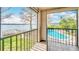 Balcony view overlooking a swimming pool and lake at 660 Killarney Bay Ct # 6, Winter Park, FL 32789