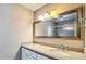 Bathroom featuring a vanity with granite countertop and large mirror at 660 Killarney Bay Ct # 6, Winter Park, FL 32789