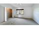 Neutral bedroom featuring a window with natural light and closet at 660 Killarney Bay Ct # 6, Winter Park, FL 32789