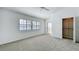 Well-lit bedroom features a ceiling fan, shuttered window and an open closet at 660 Killarney Bay Ct # 6, Winter Park, FL 32789