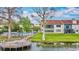 Waterfront home with balcony, community pool, private dock, and lush lawn at 660 Killarney Bay Ct # 6, Winter Park, FL 32789