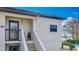 Close-up of condo exterior with staircase and updated architectural details at 660 Killarney Bay Ct # 6, Winter Park, FL 32789