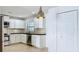 Modern kitchen featuring stainless steel appliances and plenty of cabinet space at 660 Killarney Bay Ct # 6, Winter Park, FL 32789