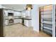 Well-lit kitchen featuring stainless steel appliances and a pantry at 660 Killarney Bay Ct # 6, Winter Park, FL 32789