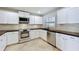 Well-equipped kitchen featuring stainless steel appliances and sleek countertops at 660 Killarney Bay Ct # 6, Winter Park, FL 32789