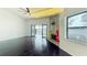 Bright and open living room with fireplace, lake views, and hardwood floors at 660 Killarney Bay Ct # 6, Winter Park, FL 32789