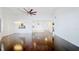 Spacious living room featuring high ceilings, hardwood floors, and modern lighting fixtures at 660 Killarney Bay Ct # 6, Winter Park, FL 32789