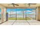 Screened-in patio offering views of a serene lake at 660 Killarney Bay Ct # 6, Winter Park, FL 32789