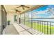 Covered patio with serene lake views and a ceiling fan at 660 Killarney Bay Ct # 6, Winter Park, FL 32789