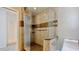 Modern shower with stone-like tile surround, glass door, and sleek fixtures at 660 Killarney Bay Ct # 6, Winter Park, FL 32789