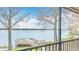 Lake view featuring a fishing pier in a park-like setting viewed from a screened lanai at 660 Killarney Bay Ct # 6, Winter Park, FL 32789
