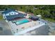 Aerial view showing home, pool, and detached workshop at 711 Cypress Ave, Orange City, FL 32763