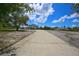 Long driveway leading to a two-story home at 711 Cypress Ave, Orange City, FL 32763