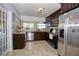 Kitchen with stainless steel appliances and granite countertops at 711 Cypress Ave, Orange City, FL 32763