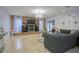 Living room with brick fireplace, large TV, and comfortable seating at 711 Cypress Ave, Orange City, FL 32763