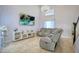 Living room featuring a sectional sofa, large TV, and high ceilings at 711 Cypress Ave, Orange City, FL 32763