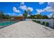 Spacious pool area with a large patio and lush landscaping at 711 Cypress Ave, Orange City, FL 32763