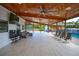 Expansive covered patio, great for entertaining, overlooking the pool at 711 Cypress Ave, Orange City, FL 32763