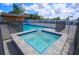 Relaxing spa adjacent to the refreshing swimming pool at 711 Cypress Ave, Orange City, FL 32763