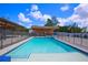 Large swimming pool with a spacious sun deck and a summer kitchen at 711 Cypress Ave, Orange City, FL 32763
