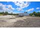 Detached workshop with large overhead doors at 711 Cypress Ave, Orange City, FL 32763