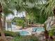 Community pool and spa area with lush landscaping at 7220 Westpointe Blvd # 1421, Orlando, FL 32835