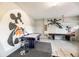 Fun game room with pool table, shuffleboard table, and themed cartoon decor at 7623 Wilmington Loop, Kissimmee, FL 34747