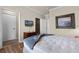 Bedroom with queen bed, wood floors, and access to the bathroom at 8020 Tuscany Way # 6401, Davenport, FL 33896