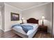 Bedroom with a queen bed, wood floors, and neutral decor at 8020 Tuscany Way # 6401, Davenport, FL 33896