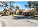 Exterior shot of the community clubhouse with a porte-cochere and tile roof at 8020 Tuscany Way # 6401, Davenport, FL 33896
