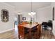 Spacious dining area with hardwood floors and chandelier at 8020 Tuscany Way # 6401, Davenport, FL 33896