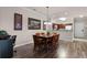 Cozy dining area adjacent to the kitchen features a wooden table with seating for six at 8020 Tuscany Way # 6401, Davenport, FL 33896