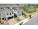 Aerial view of two homes with solar panels and a paved driveway at 828 Scrub Oak Hammock Rd, Davenport, FL 33837