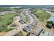 Aerial view of a residential area with houses near a pond at 828 Scrub Oak Hammock Rd, Davenport, FL 33837